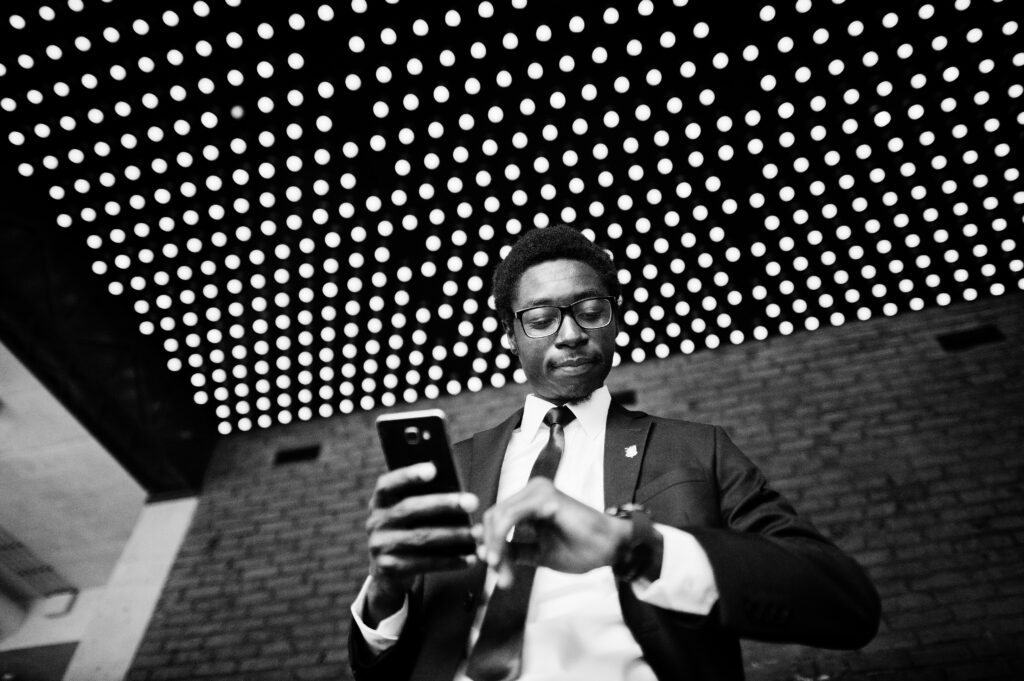Business african american man wear on black suit and glasses at